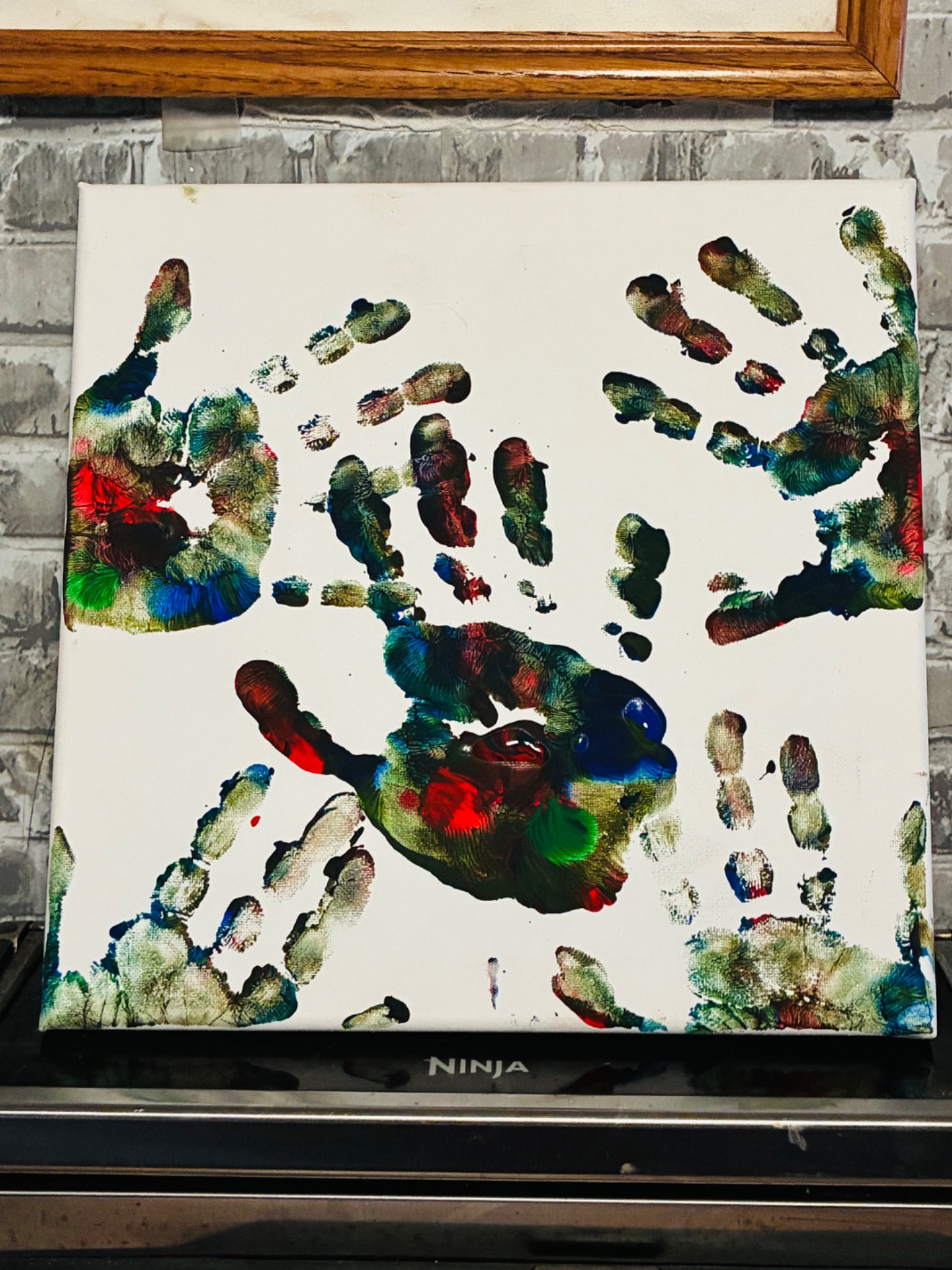 Rocco’s original multicolored handprint made with layered paint